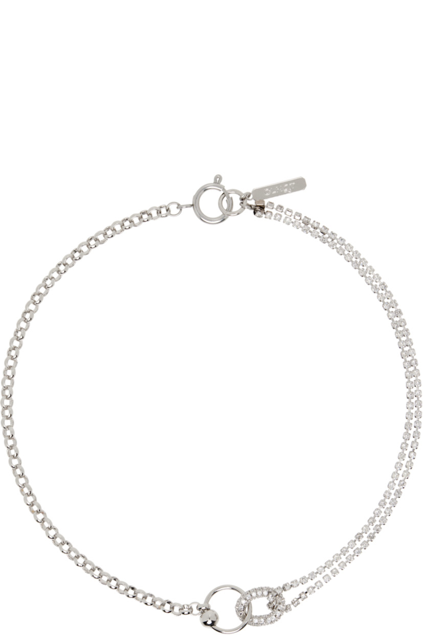 Handcrafted rolo chain and tiered cup chain choker in palladium-plated brass.

· Prong-set crystals at length
· Charms at drop
· Logo plaque at spring-ring fastening
· L15"

Supplier color: Palladium