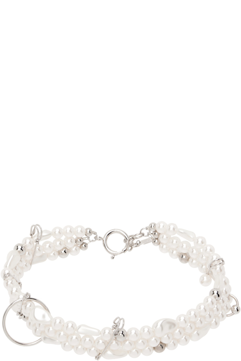 Handcrafted tiered faux-pearl choker in white. 

· Graphic charms throughout 
· Logo plaque at adjustable spring-ring fastening 
· Palladium-plated brass hardware
· L14.5"

Supplier color: Palladium