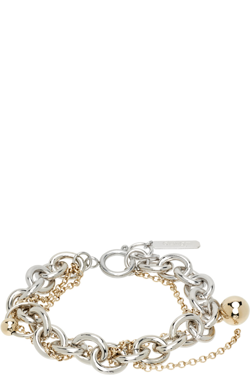 Handcrafted tiered cable chain and rolo chain bracelet in 24k gold- and palladium-plated brass.

· Charms at length
· Logo plaque at adjustable spring-ring fastening 
· L7.5"

Available exclusively at SSENSE.

Supplier color: Palladium