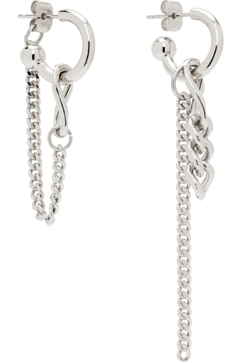 Pair of handcrafted and mismatched drop earrings in palladium-plated brass.

· Curb chain at drop 
· Post-stud fastening 
· H2.5" x W0.5"; H1.75" x W0.5"

Supplier color: Palladium