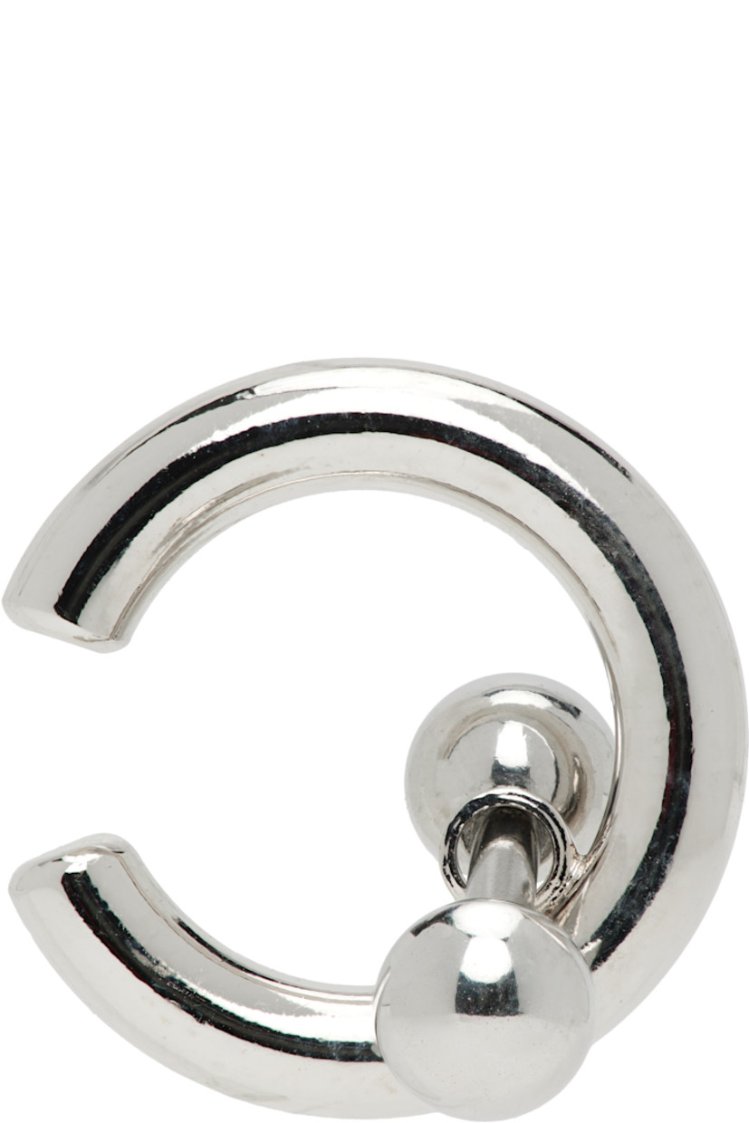 Handcrafted single ear cuff in in palladium-plated brass.

· Charms at drop 
· H0.5" x W0.5"

Supplier color: Palladium