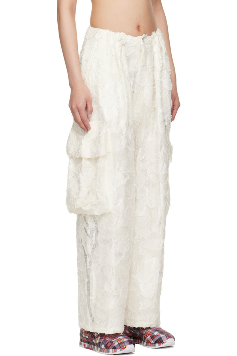Lightweight cotton-blend twill cargo pants. Floral fil-coupé pattern throughout.

· Belt loops
· Four-pocket styling
· Zip fly
· Pleats at front
· Cargo pocket at outseams
· Rhinestone appliqués at lower legs

Supplier color: White