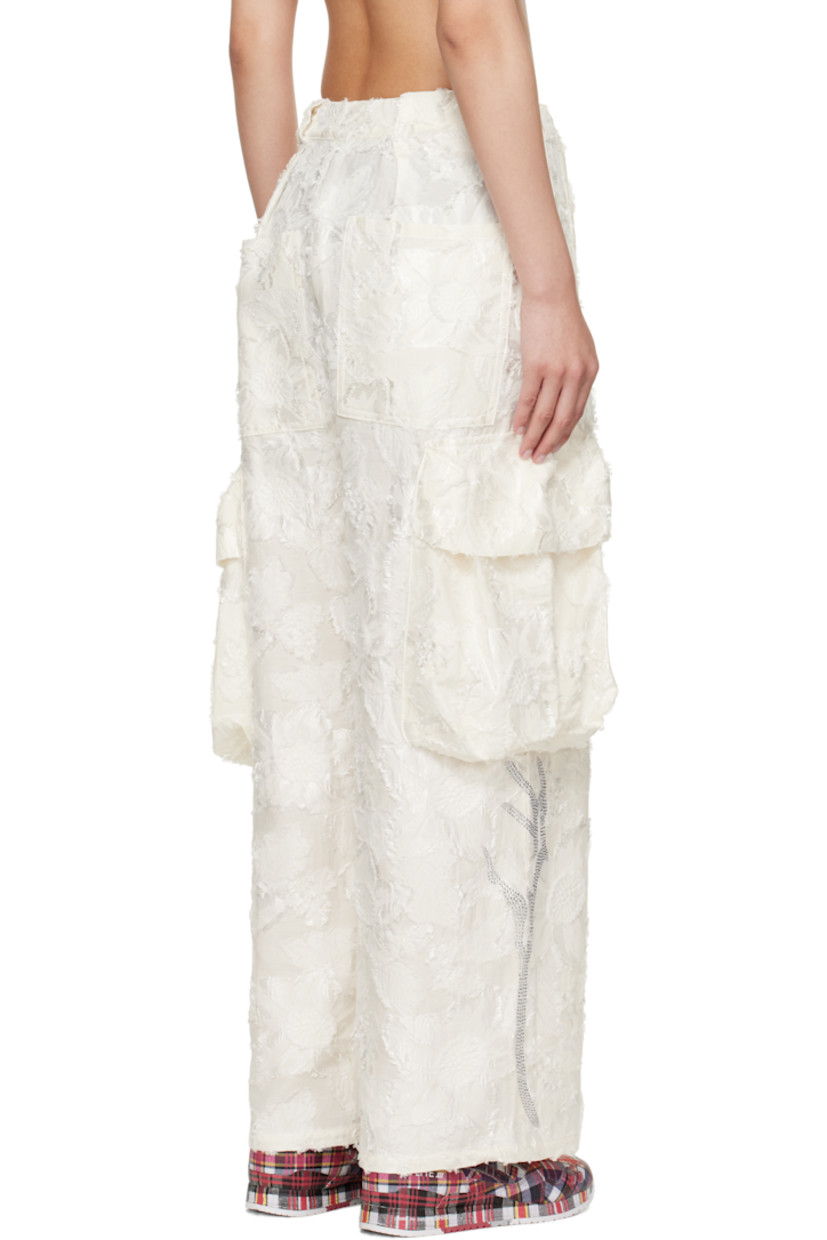 Lightweight cotton-blend twill cargo pants. Floral fil-coupé pattern throughout.

· Belt loops
· Four-pocket styling
· Zip fly
· Pleats at front
· Cargo pocket at outseams
· Rhinestone appliqués at lower legs

Supplier color: White