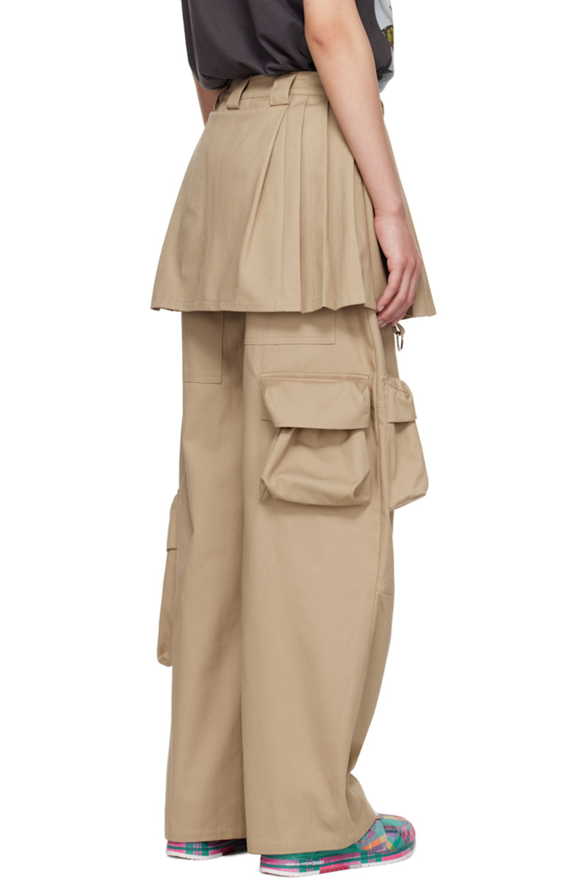 Cotton twill cargo pants. Integrated pleated skirt overlay at waistband.

· Paneled construction
· Belt loops
· Three-pocket styling
· Concealed zip closure at outseam waist
· D-ring at front leg
· Offset cargo pockets 
· Silver-tone hardware

Supplier color: Khaki