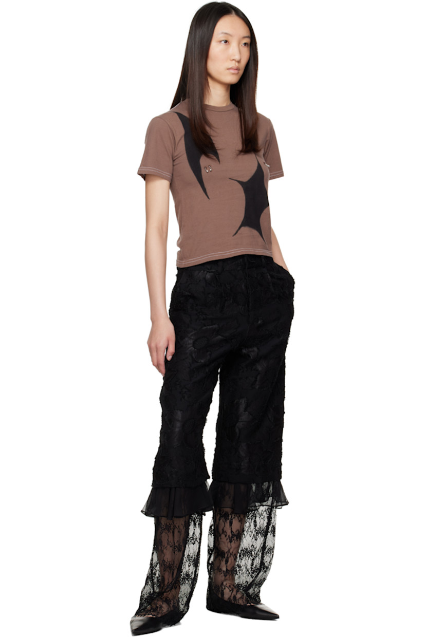 Relaxed-fit woven cotton-blend trousers. Floral fil-coupé pattern throughout.

· Paneled construction
· Mid-rise
· Belt loops
· Four-pocket styling
· Zip fly
· Pleats at front
· Ruffled trim at knees
· Sheer embroidered lace panel at lower legs

Supplier color: Black