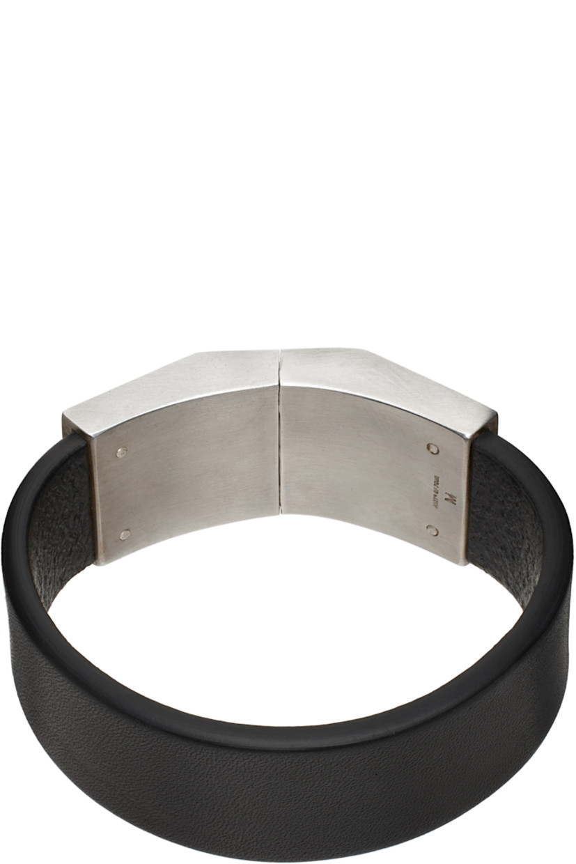 Handcrafted buffed buffalo leather bracelet in black. 

· Box clasp
· Logo engraved at inner side
· Logo-engraved silver-tone brass hardware 

Supplier color: Black buffalo leather