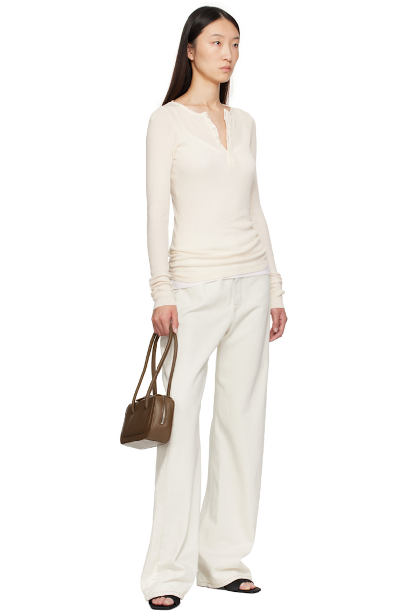 Pebble-grained calfskin shoulder bag.

· Post-stud tab at fixed shoulder straps
· Logo embossed at face
· Two-way zip closure
· Card slot at interior
· Faille lining
· H5" x W10.25" x D3"

Supplier color: Grain brownie
