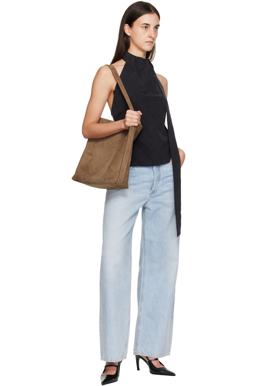 Calfskin suede tote.

· Fixed shoulder strap
· Logo embossed at face
· Magnetic closure
· Patch pocket at interior
· Faille lining
· H13.75" x W16" x D5.25"

Supplier color: Suede date