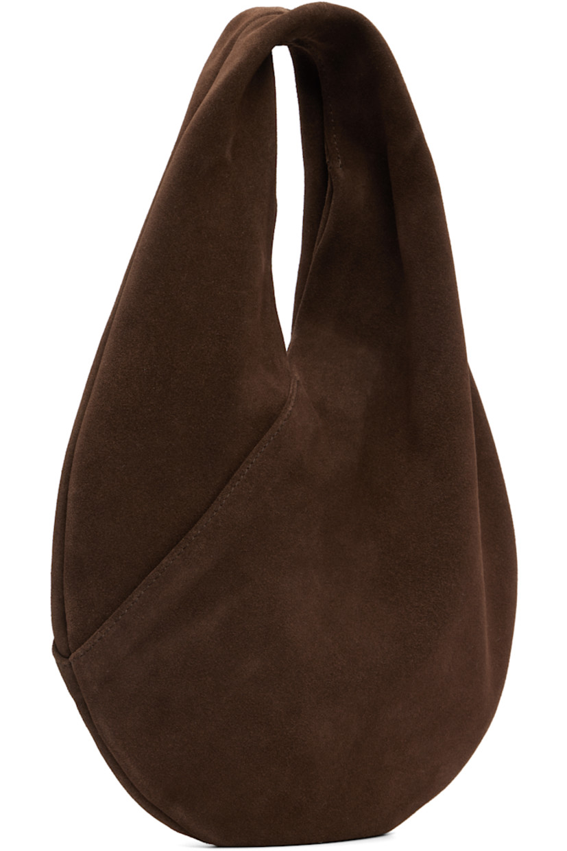 Calfskin suede shoulder bag.

· Integrated shoulder strap
· Logo embossed at face
· Magnetic closure
· Unlined
· H9.5" x W10" 
· Total height: H13"

Supplier color: Suede cocoa