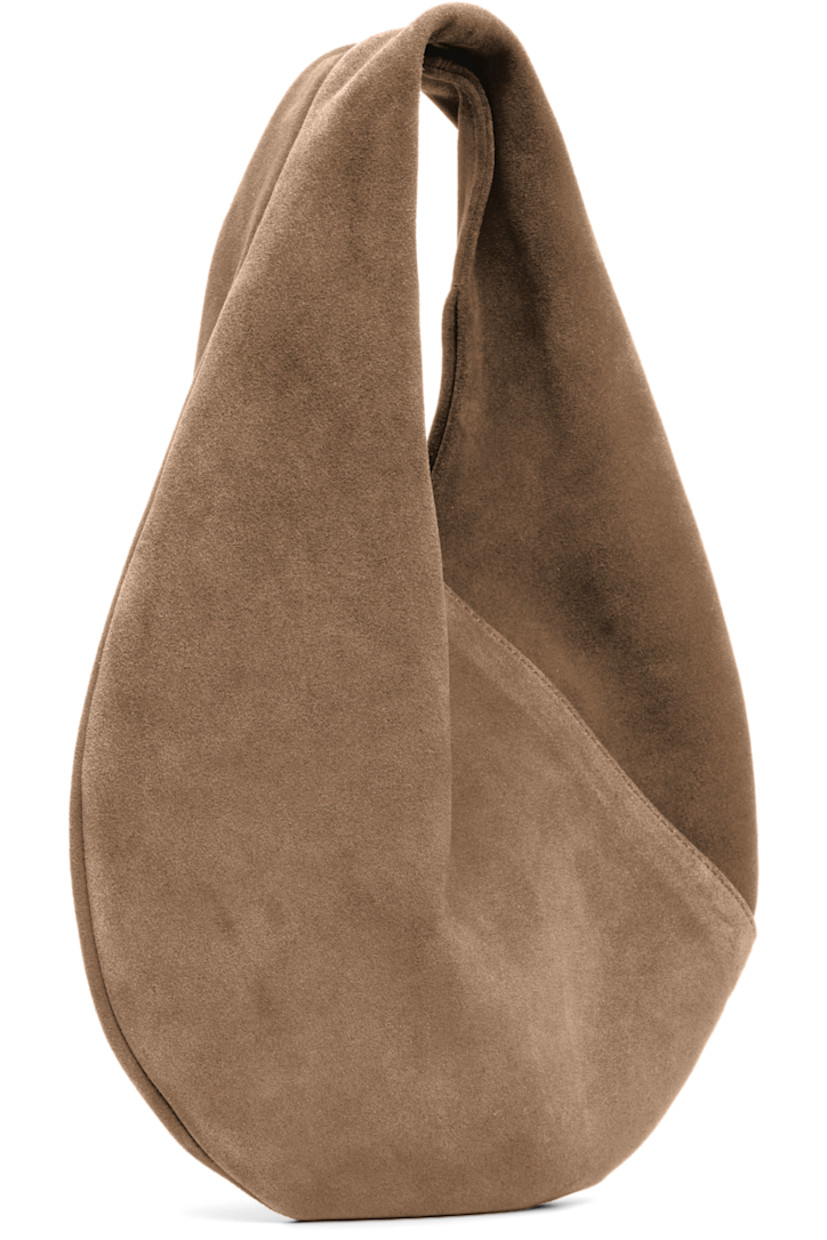Calfskin suede shoulder bag.

· Integrated shoulder strap
· Logo embossed at face
· Magnetic closure
· Unlined
· H9.5" x W10" 
· Total height: H13"
 
Supplier color: Suede date