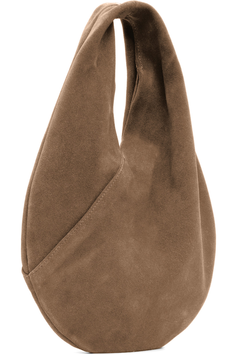 Calfskin suede shoulder bag.

· Integrated shoulder strap
· Logo embossed at face
· Magnetic closure
· Unlined
· H9.5" x W10" 
· Total height: H13"
 
Supplier color: Suede date