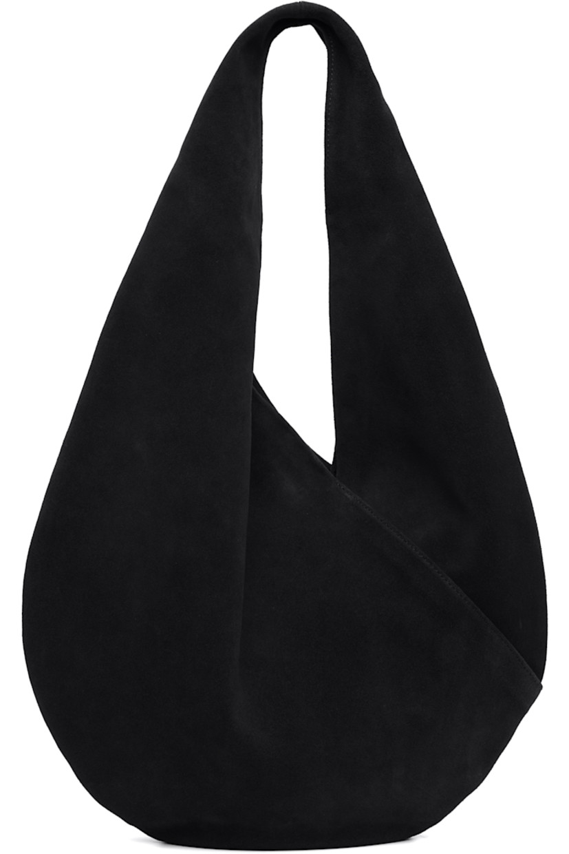 Calfskin suede shoulder bag.

· Integrated shoulder strap
· Logo embossed at face
· Magnetic closure
· Unlined
· H10.5" x W14.5" 
· Total height: H18.5"

Supplier color: Suede black
