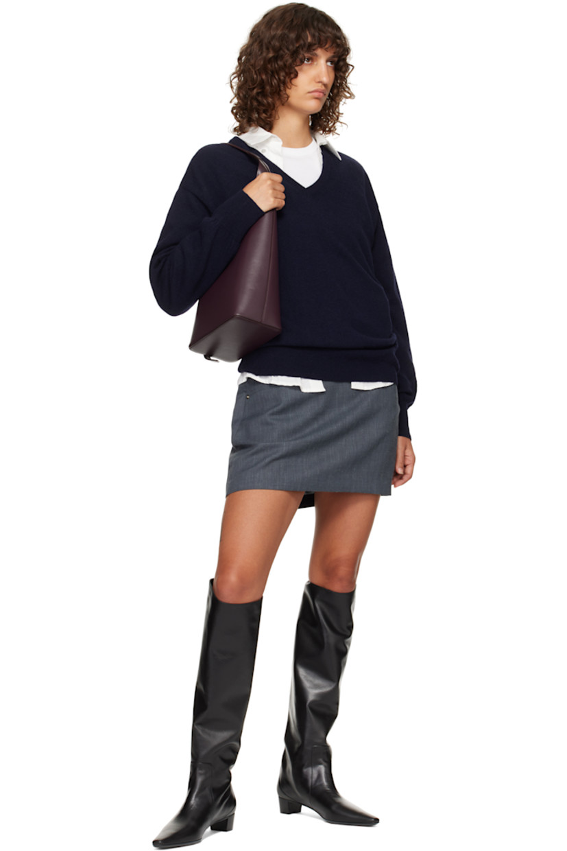 Buffed calfskin shoulder bag.

· Adjustable shoulder strap
· Logo embossed at face
· Magnetic closure
· Patch pocket at eco-suede interior
· H15.5" x W8" x D4.5"
· Total height: H18"

Supplier color: Fig