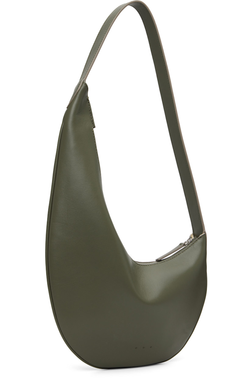 Grained calfskin shoulder bag.

· Fixed shoulder strap
· Logo embossed at face
· Zip closure
· Faille lining
· H14.5" x W10"
· Total height: H17.5"

Supplier color: Sage