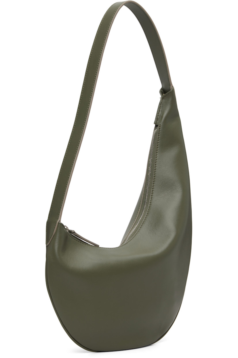 Grained calfskin shoulder bag.

· Fixed shoulder strap
· Logo embossed at face
· Zip closure
· Faille lining
· H14.5" x W10"
· Total height: H17.5"

Supplier color: Sage
