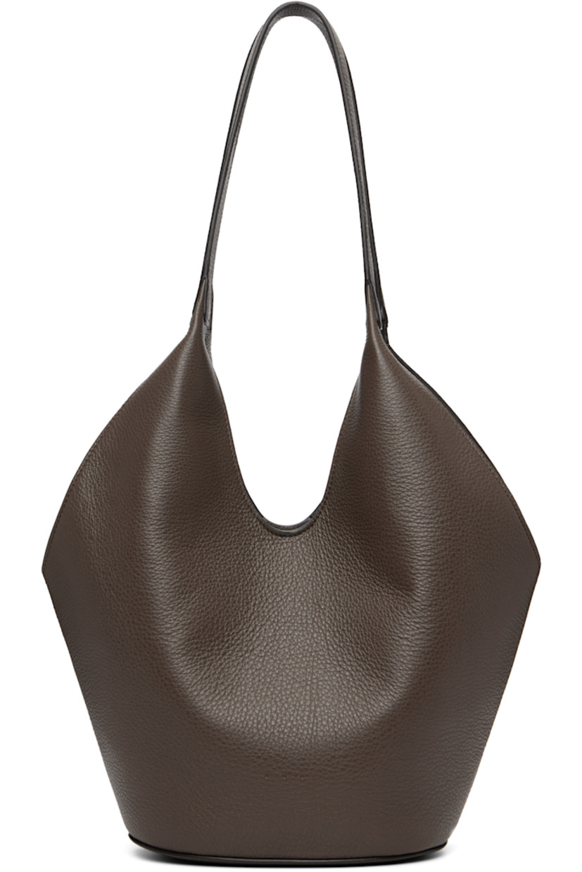 Grained calfskin tote.

· Fixed shoulder straps
· Logo embossed at face
· Magnetic closure
· Card slot at interior
· Faille lining
· H13" x W14" x D5.5"

Available exclusively at SSENSE.

Supplier color: Grain chestnut