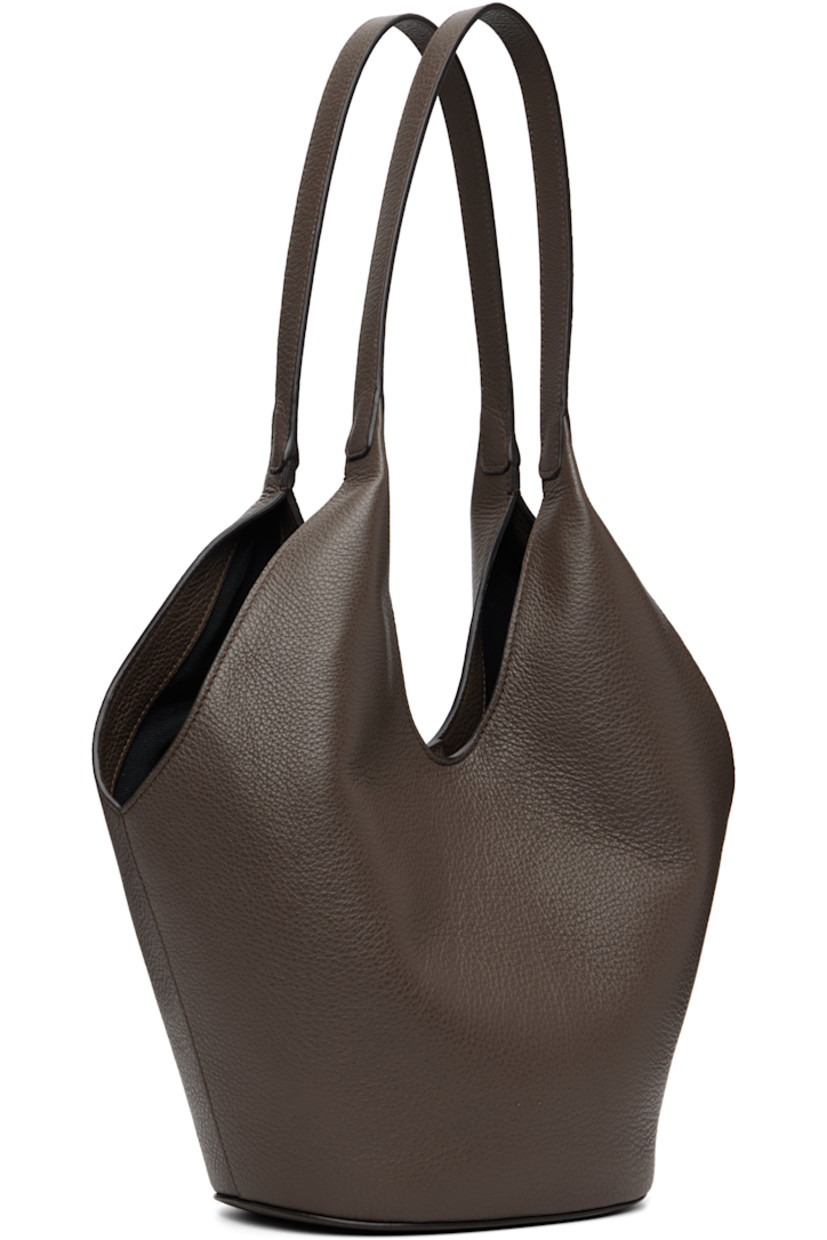 Grained calfskin tote.

· Fixed shoulder straps
· Logo embossed at face
· Magnetic closure
· Card slot at interior
· Faille lining
· H13" x W14" x D5.5"

Available exclusively at SSENSE.

Supplier color: Grain chestnut