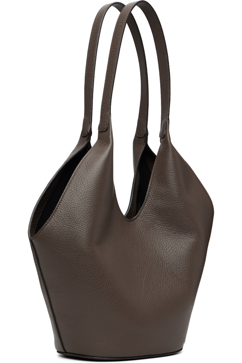 Grained calfskin tote.

· Fixed shoulder straps
· Logo embossed at face
· Magnetic closure
· Card slot at interior
· Faille lining
· H13" x W14" x D5.5"

Available exclusively at SSENSE.

Supplier color: Grain chestnut