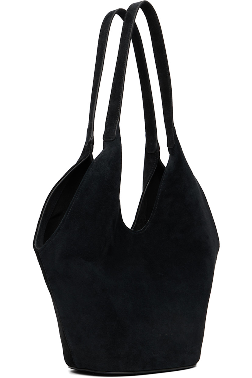 Suede tote.

· Fixed shoulder straps
· Logo embossed at face
· Magnetic closure
· Patch pocket at interior
· Faille lining
· H12" x W14" x D5.5"

Available exclusively at SSENSE.

Supplier color: Suede black