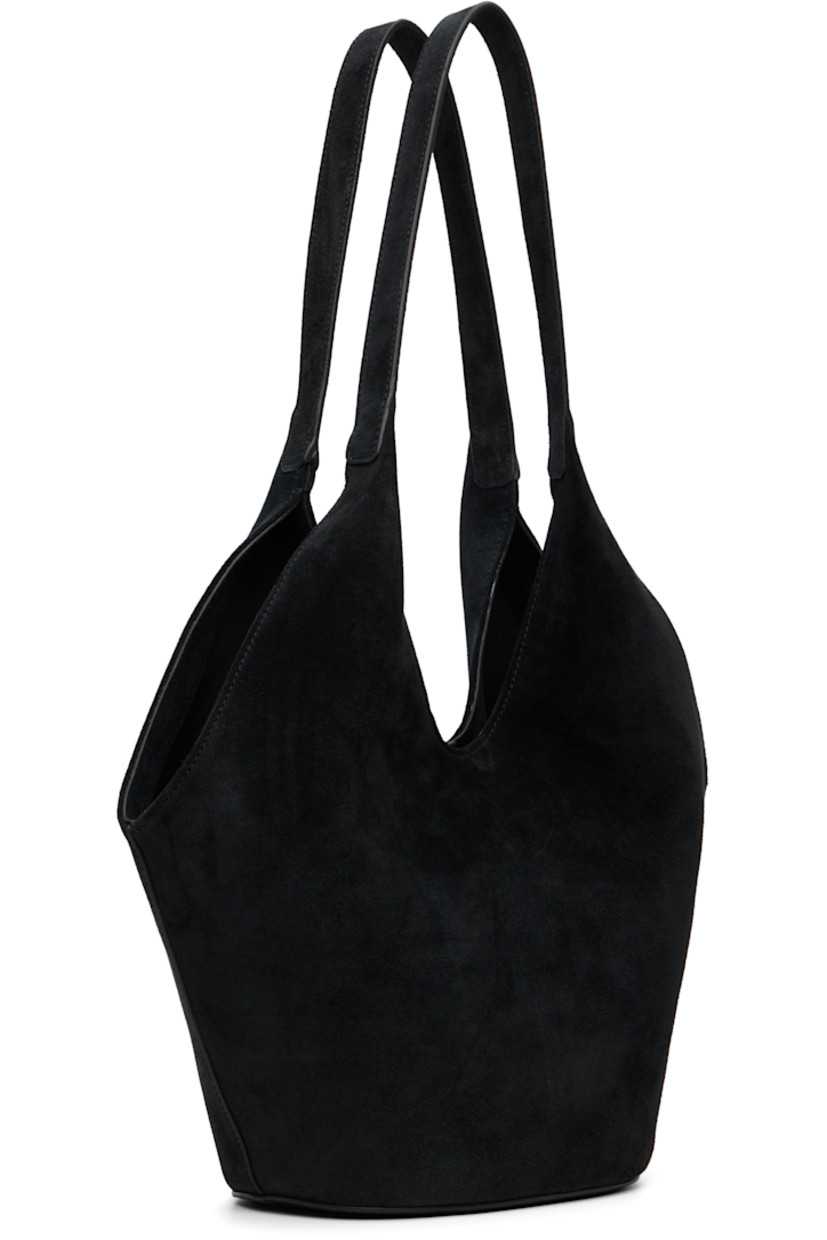 Suede tote.

· Fixed shoulder straps
· Logo embossed at face
· Magnetic closure
· Patch pocket at interior
· Faille lining
· H12" x W14" x D5.5"

Available exclusively at SSENSE.

Supplier color: Suede black