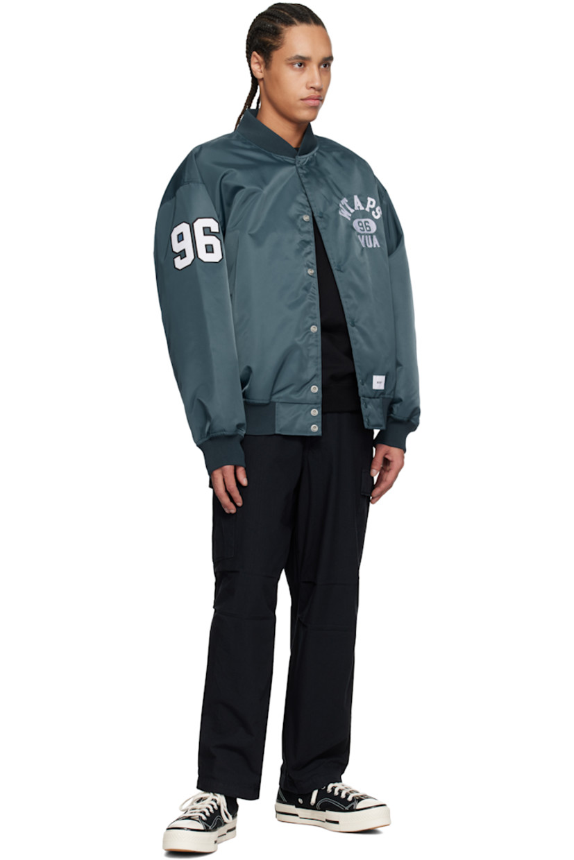 Overdyed cotton ripstop cargo pants.

· Belt loops
· Four-pocket styling
· Zip fly
· Pleats at knees
· Drawstring at cuffs
· Cargo pocket at outseams
· Logo patch at outseam
· Logo flag at back leg

Supplier color: Black