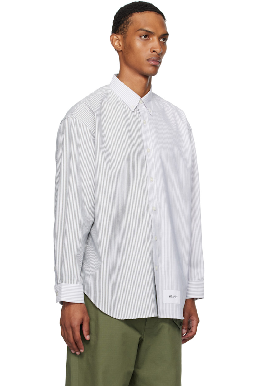 Cotton-blend oxford cloth shirt. 

· Stripes throughout
· Spread collar
· Button closure
· Logo patch at front
· Shirttail hem
· Logo flag at side seam
· Adjustable buttoned barrel cuffs
· Text patch at back collar

Supplier color: Black