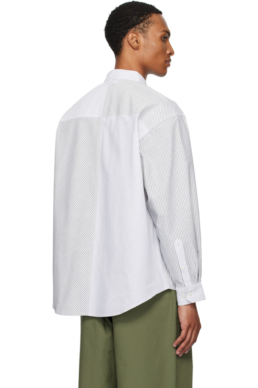 Cotton-blend oxford cloth shirt. 

· Stripes throughout
· Spread collar
· Button closure
· Logo patch at front
· Shirttail hem
· Logo flag at side seam
· Adjustable buttoned barrel cuffs
· Text patch at back collar

Supplier color: Black