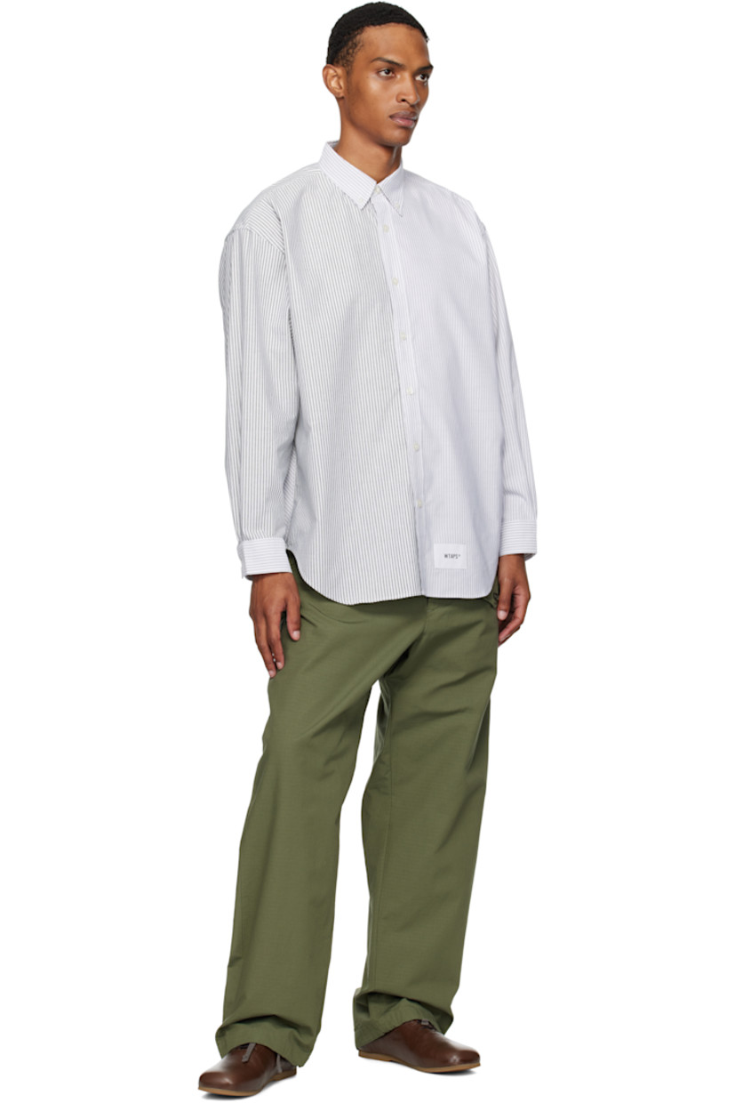 Cotton-blend oxford cloth shirt. 

· Stripes throughout
· Spread collar
· Button closure
· Logo patch at front
· Shirttail hem
· Logo flag at side seam
· Adjustable buttoned barrel cuffs
· Text patch at back collar

Supplier color: Black