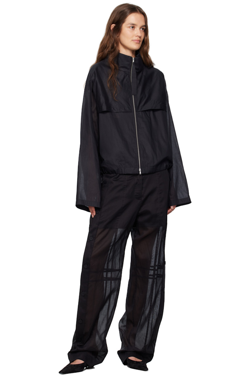 Sheer cotton muslin jacket.

· Paneled construction
· Stand collar
· Two-way zip closure
· Storm flap at front and back
· Zip pockets at waist
· Drawstring at hem
· Unlined

Supplier color: Black