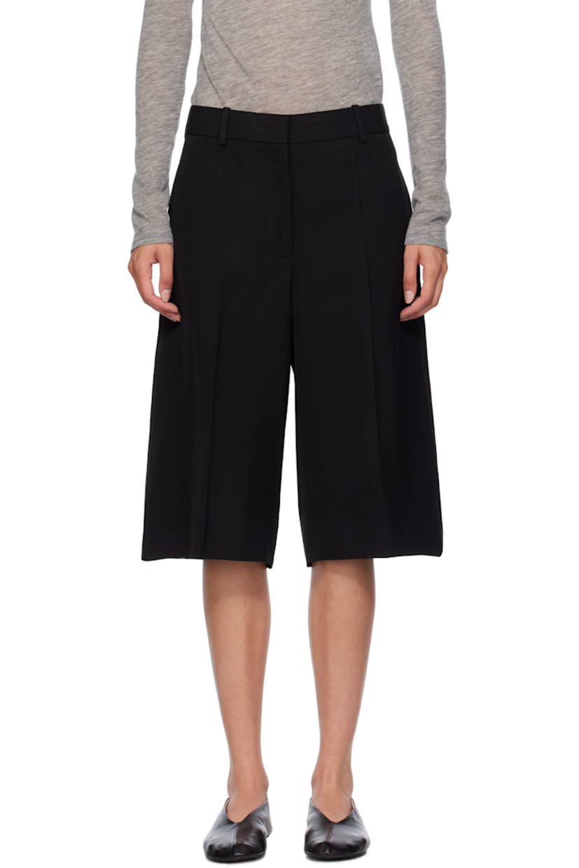 Viscose- and silk-blend crêpe shorts.

· Belt loops
· Zip fly
· Central crease at front
· Silk-blend satin twill overlay at back legs
· Raw edge at back cuffs

Supplier color: Black