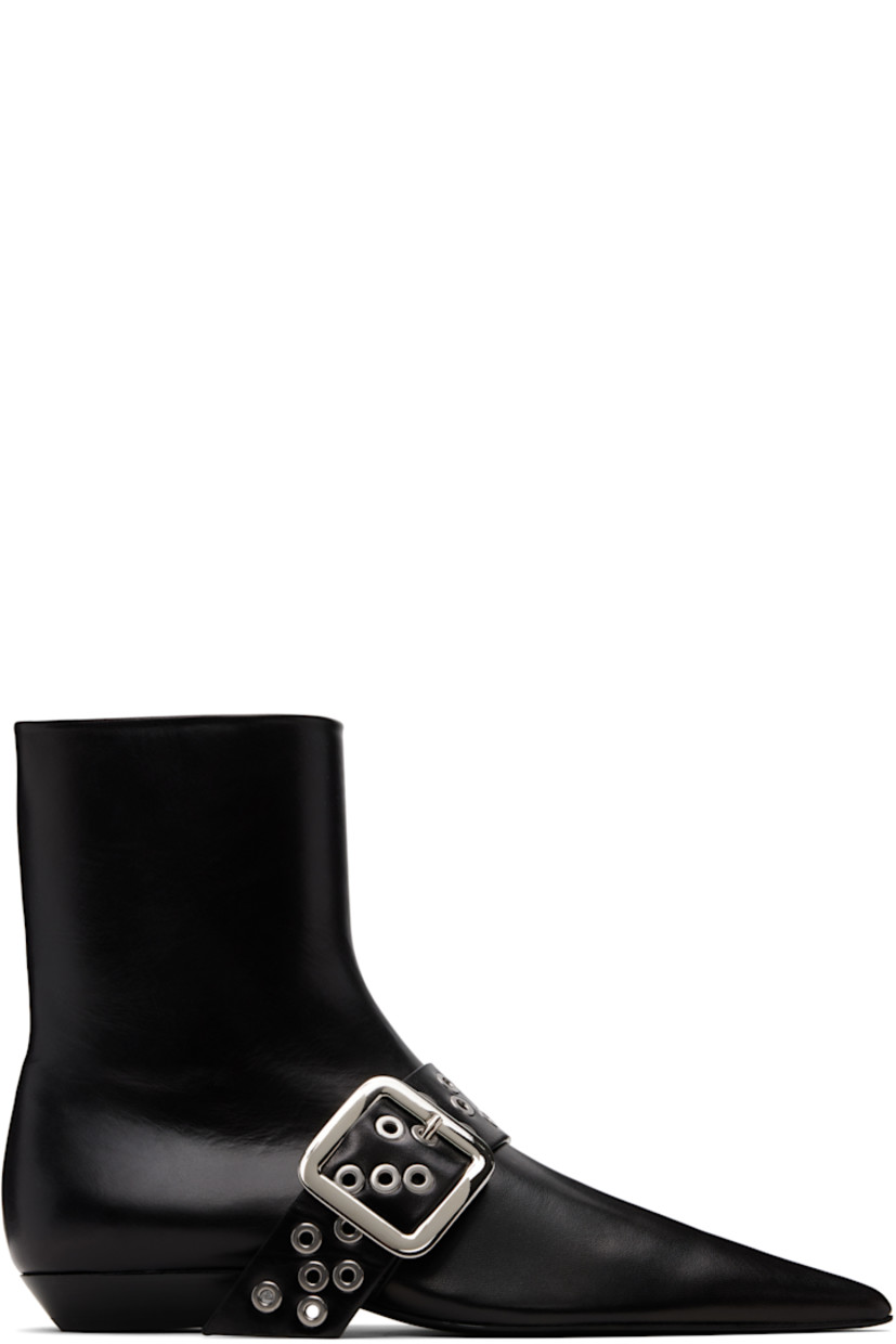 Ankle-high grained goatskin boots.

· Pointed toe 
· Pin-buckle strap with grommets at vamp
· Zip closure at inner side
· Stacked leather block heel 
· Leather sole with rubber injections 

Supplier color: Black
