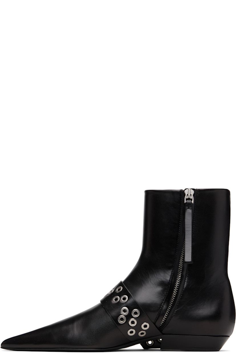 Ankle-high grained goatskin boots.

· Pointed toe 
· Pin-buckle strap with grommets at vamp
· Zip closure at inner side
· Stacked leather block heel 
· Leather sole with rubber injections 

Supplier color: Black