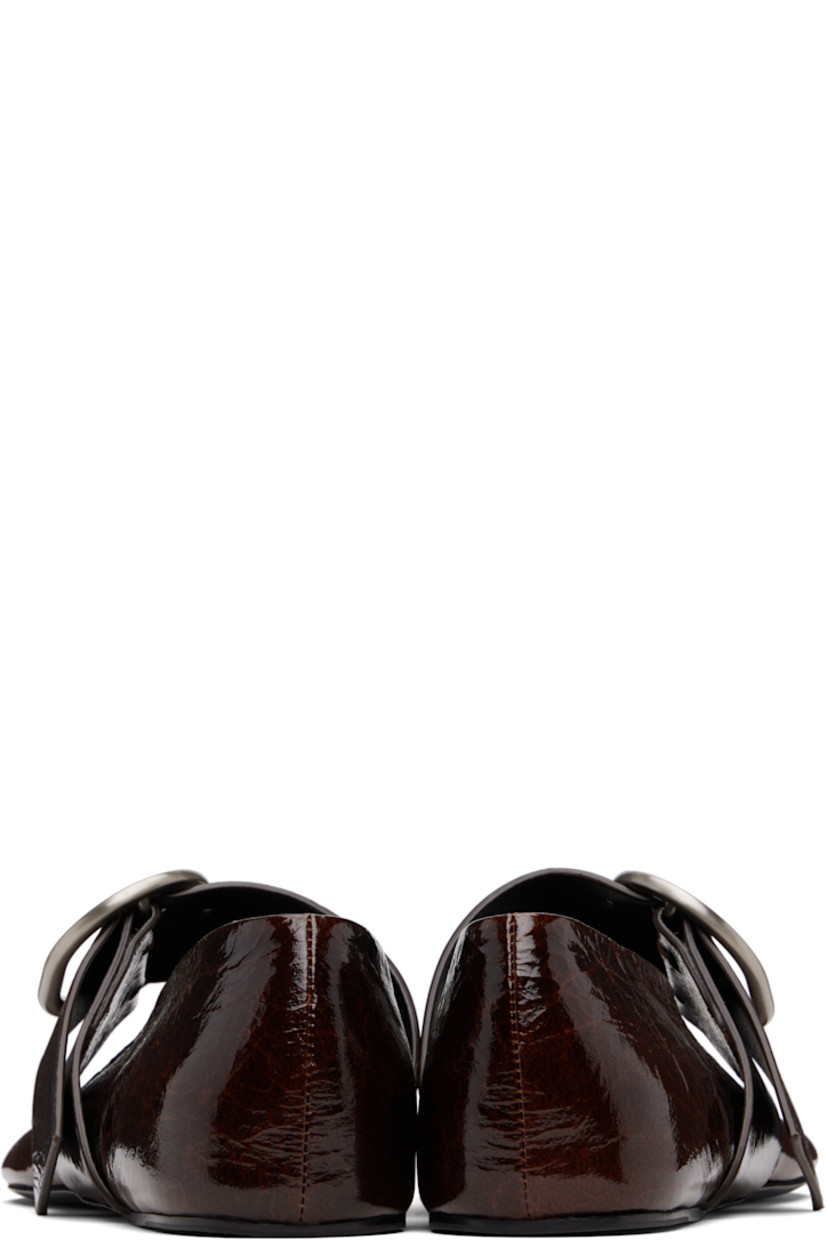 Crackled patent goatskin ballerina flats.

· Modified round toe
· Pin-buckle strap at vamp
· Leather sole with rubber injections 

Supplier color: Dark earth