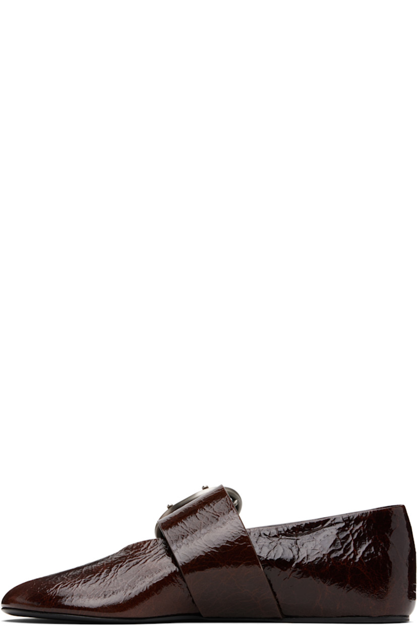 Crackled patent goatskin ballerina flats.

· Modified round toe
· Pin-buckle strap at vamp
· Leather sole with rubber injections 

Supplier color: Dark earth