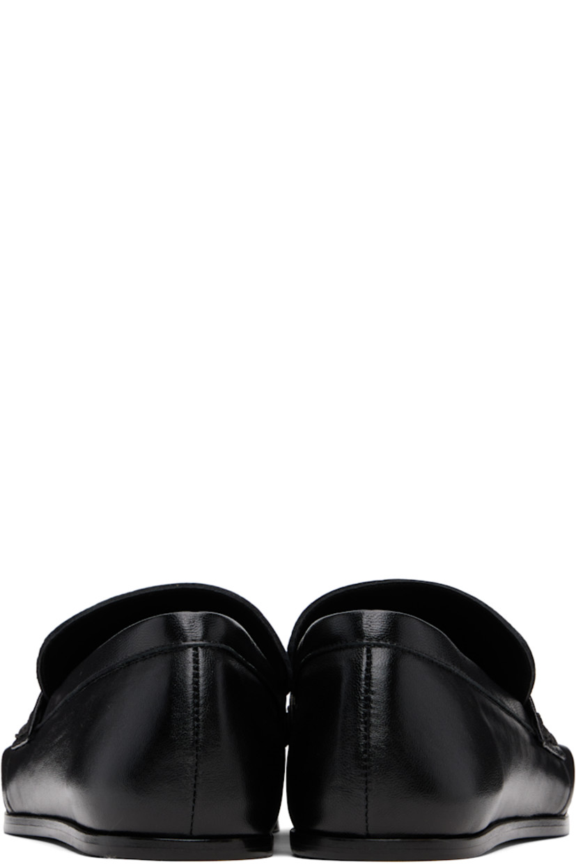 Grained sheepskin loafers.

· Square toe 
· Cutouts with D-rings at toe and sides
· Strap at vamp
· Leather sole with rubber injections 

Supplier color: Black
