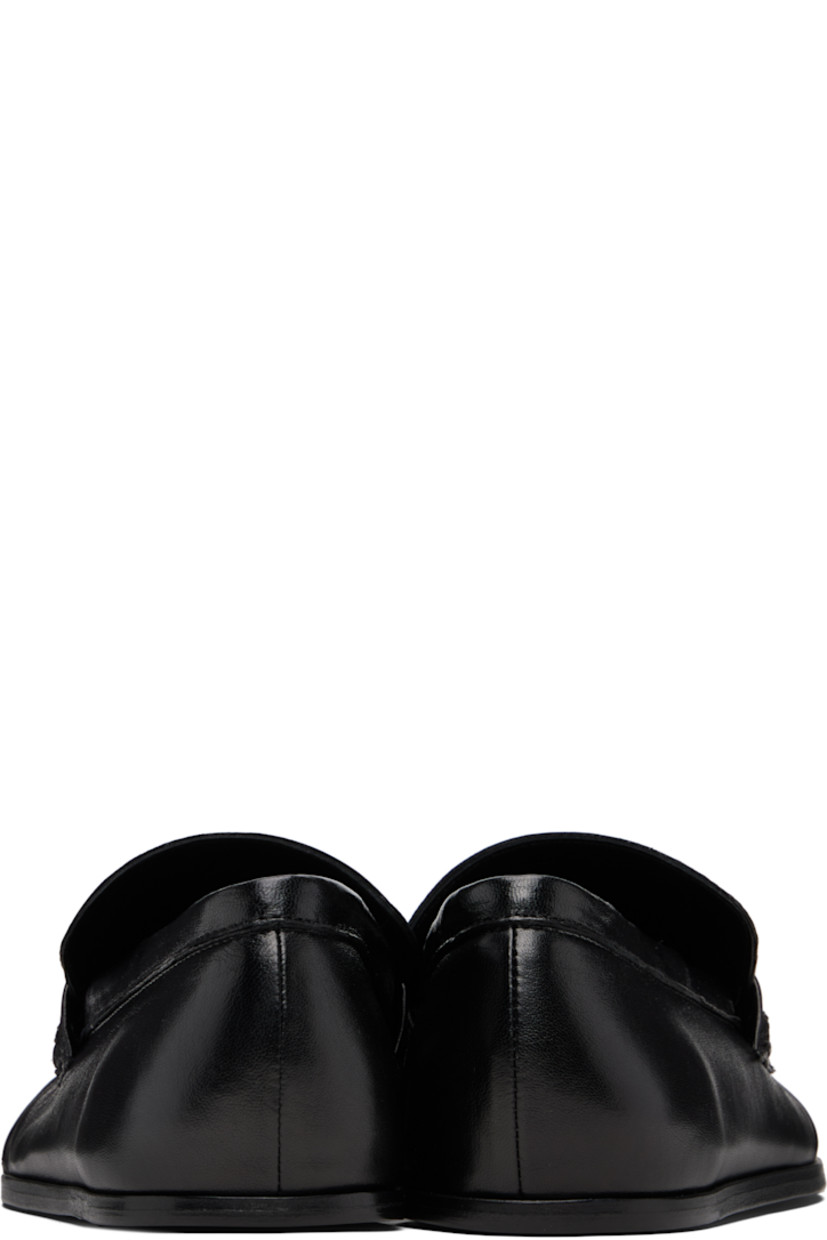 Grained sheepskin loafers.

· Square toe 
· Hand-stitched gathering at toe
· Strap at vamp
· Leather sole with rubber injections 

Supplier color: Black