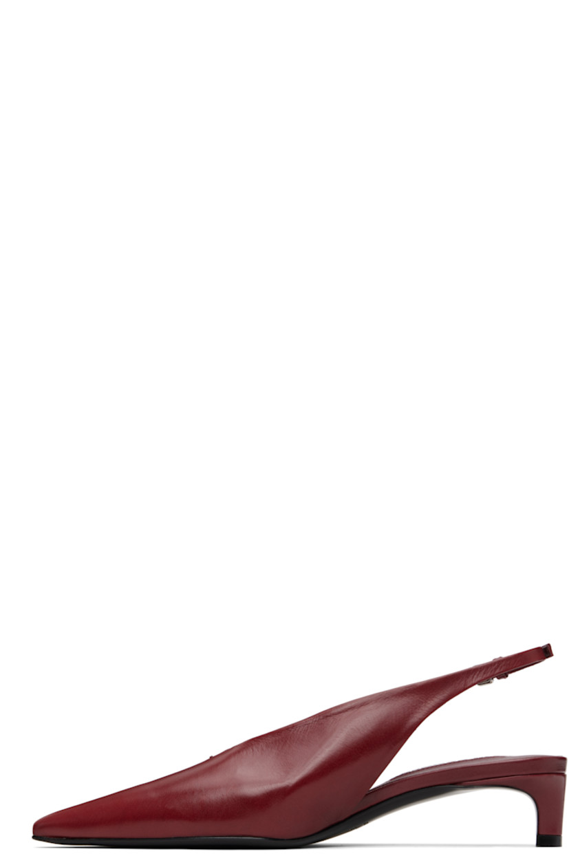 Grained calfskin heels. 

· Pointed toe 
· Stitch at vamp
· Pin-buckle slingback strap
· Covered kitten heel
· Leather sole with rubber injections
· Heel: H1.5"

Supplier color: Cedar red