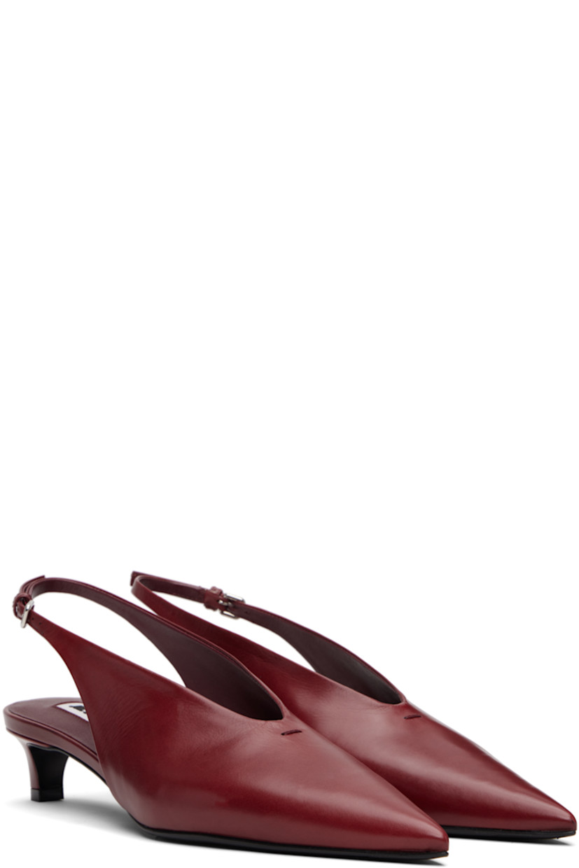 Grained calfskin heels. 

· Pointed toe 
· Stitch at vamp
· Pin-buckle slingback strap
· Covered kitten heel
· Leather sole with rubber injections
· Heel: H1.5"

Supplier color: Cedar red