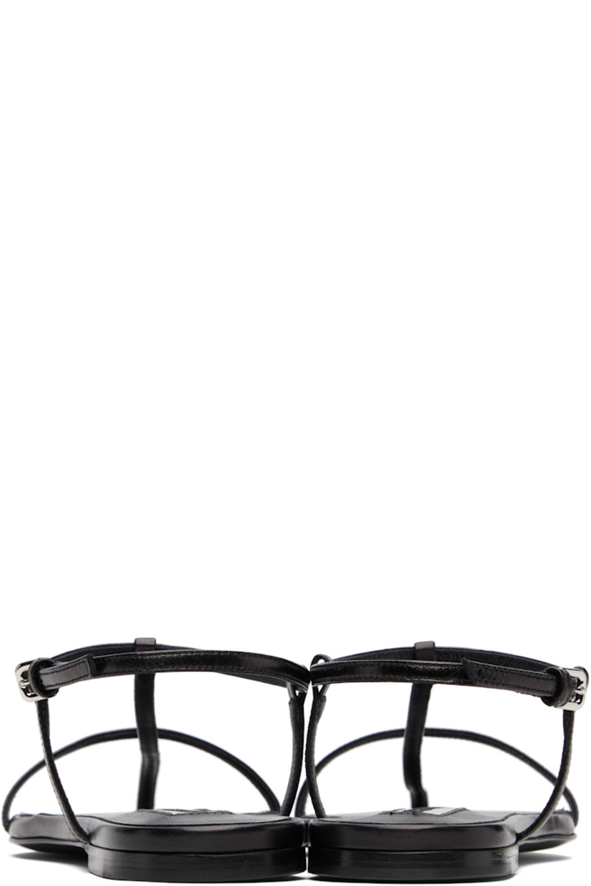 Buffed calfskin flat sandals.

· Pointed open toe 
· Pin-buckle ankle strap
· Leather sole with rubber injections

Supplier color: Black