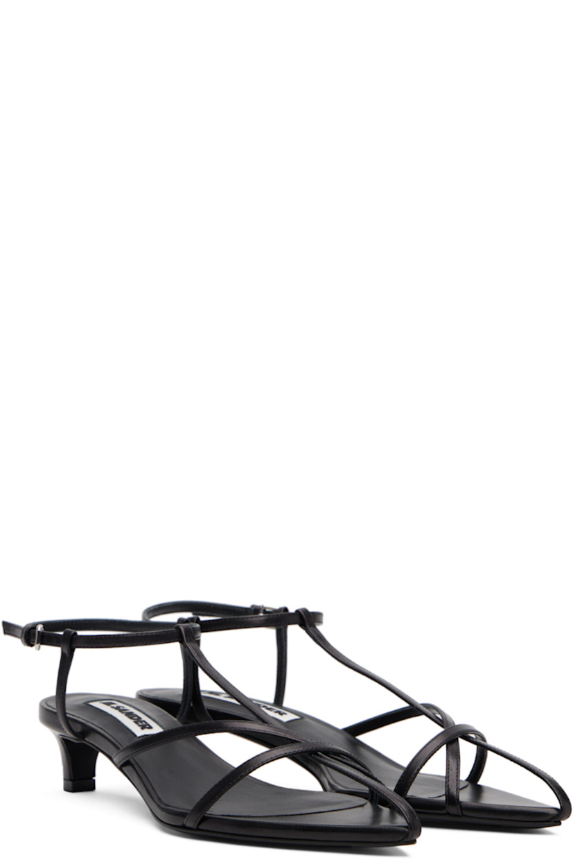 Buffed goatskin heeled sandals.

· Pointed open toe 
· Pin-buckle ankle strap
· Covered kitten heel 
· Leather sole with rubber injections
· Heel: H1.5"

Supplier color: Black