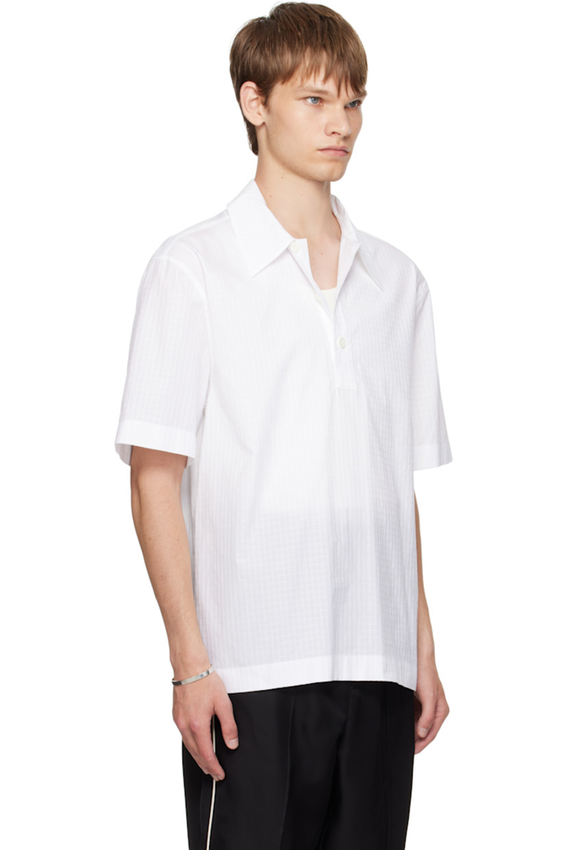 Cotton ripstop polo.

· Spread collar
· Three-button placket
· Pleats at back yoke

Supplier color: Optic white