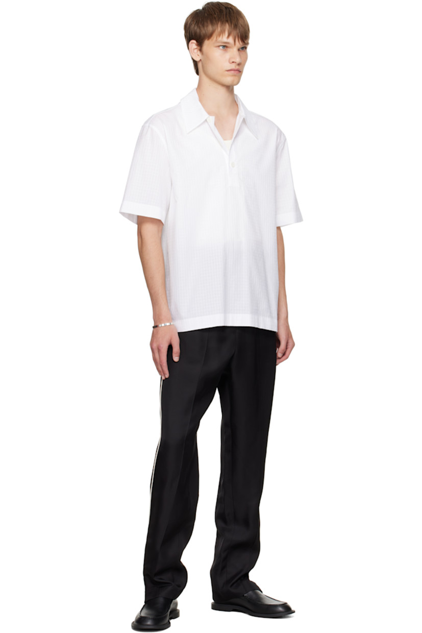 Cotton ripstop polo.

· Spread collar
· Three-button placket
· Pleats at back yoke

Supplier color: Optic white