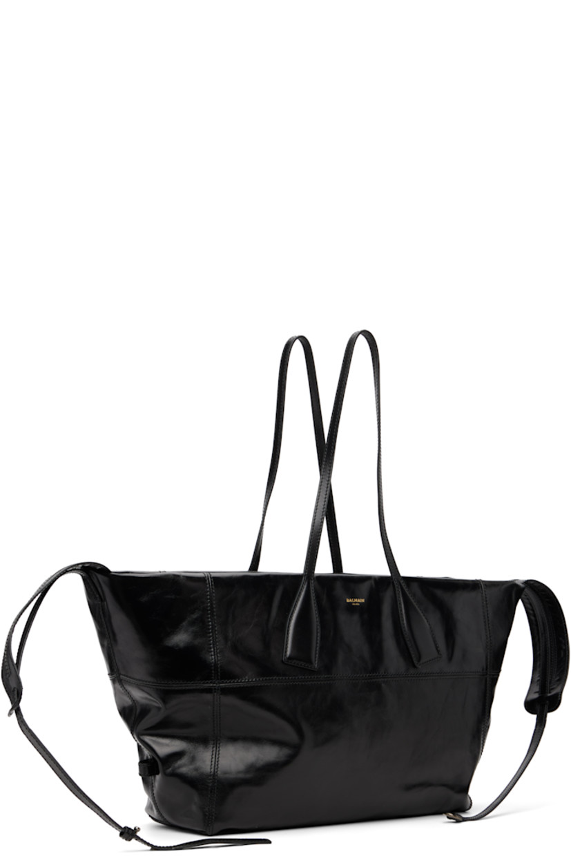 Crinkled polished calfskin tote.

· Twin shoulder straps
· Detachable crossbody strap
· Logo stamp at face
· Two-way zip closure
· Card slot and patch pocket at interior
· Cotton twill lining
· H12" x W25" x D6"

Supplier color: Black