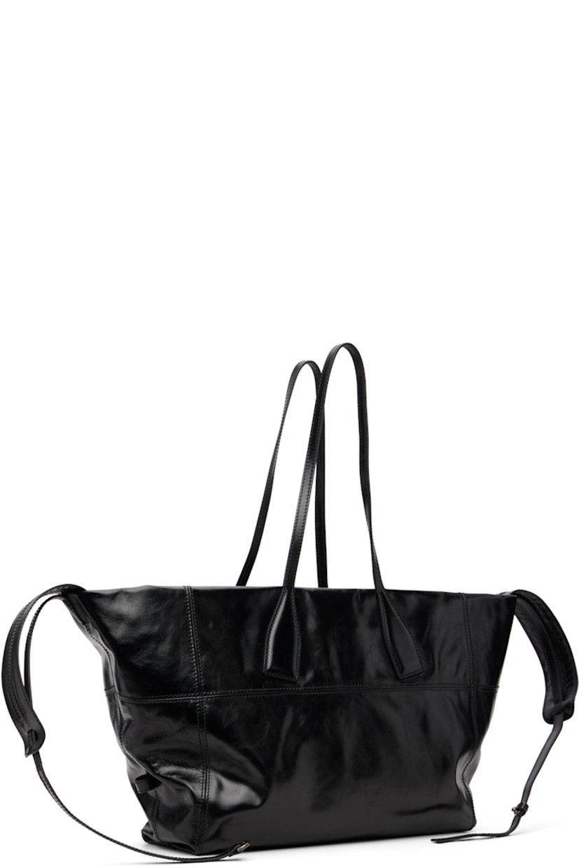 Crinkled polished calfskin tote.

· Twin shoulder straps
· Detachable crossbody strap
· Logo stamp at face
· Two-way zip closure
· Card slot and patch pocket at interior
· Cotton twill lining
· H12" x W25" x D6"

Supplier color: Black