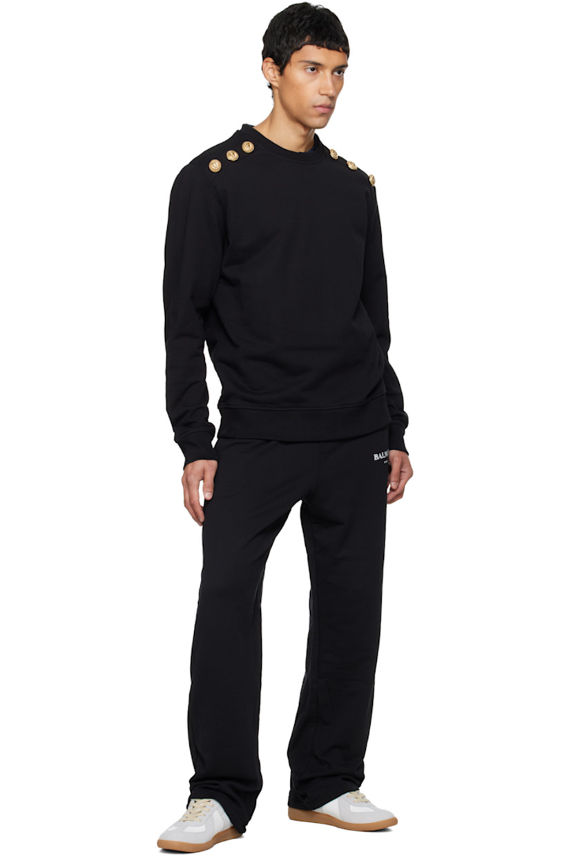 French terry sweatshirt.

· Rib-knit crewneck, hem, and cuffs
· Logo-engraved graphic hardware at shoulders
· Dropped shoulders
· Gold-tone hardware

Supplier color: Black