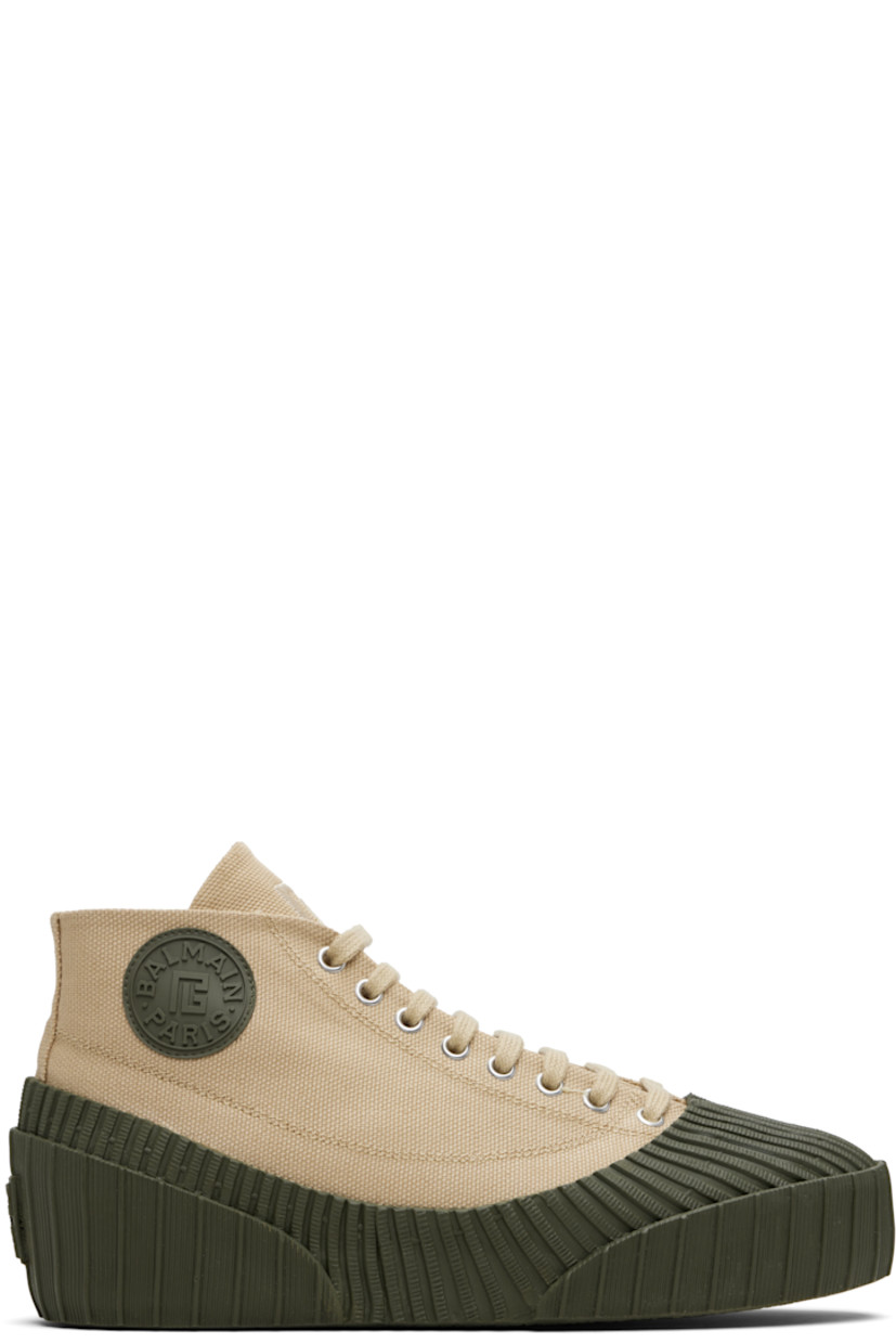 High-top cotton canvas and rubber sneakers.

· Rubber cap toe
· Lace-up closure
· Logo embroidered at tongue
· Rubberized logo patch at outer side and heel
· Canvas lining
· Treaded vulcanized rubber sole

Supplier color: Beige
