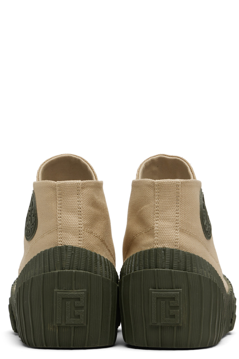 High-top cotton canvas and rubber sneakers.

· Rubber cap toe
· Lace-up closure
· Logo embroidered at tongue
· Rubberized logo patch at outer side and heel
· Canvas lining
· Treaded vulcanized rubber sole

Supplier color: Beige