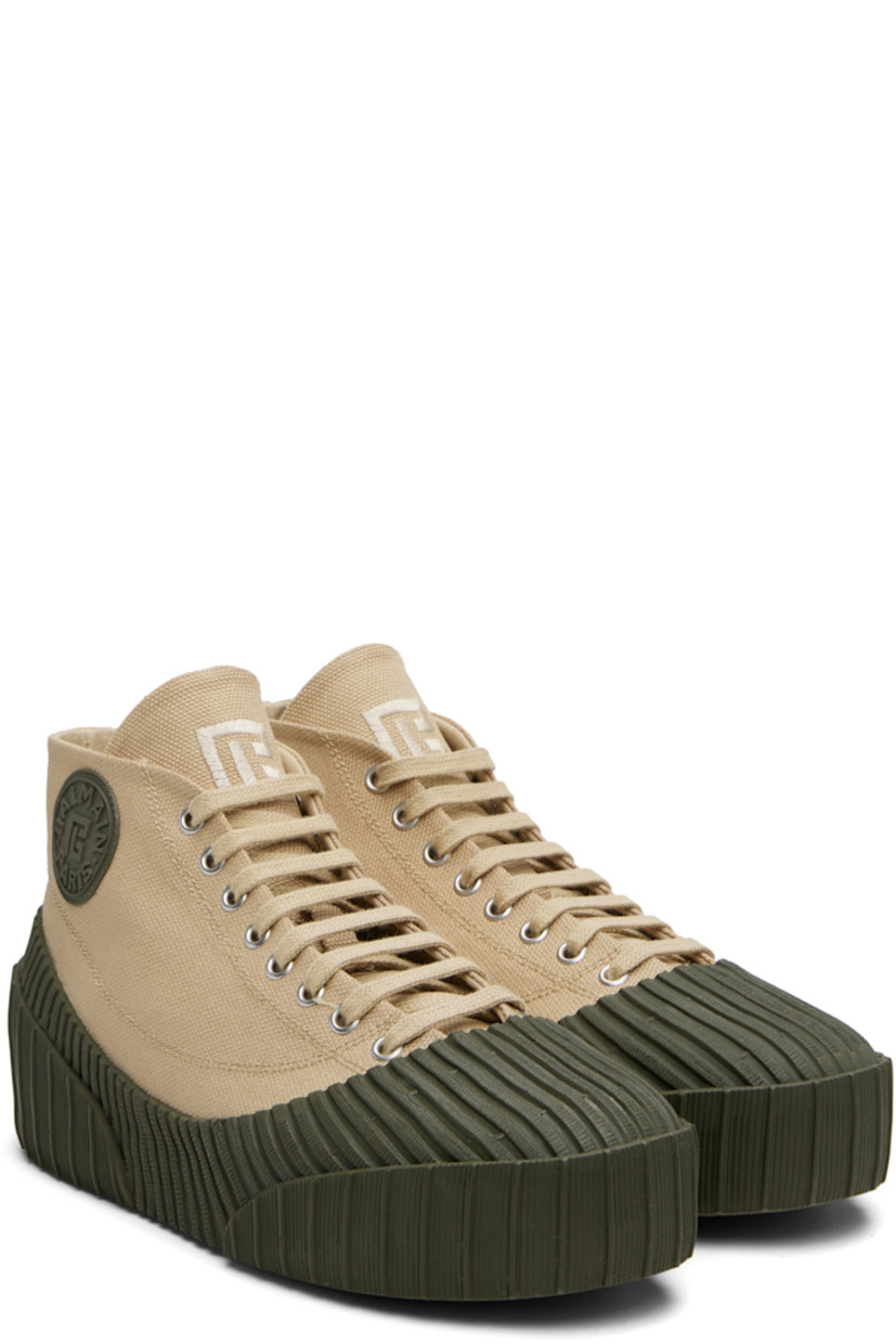 High-top cotton canvas and rubber sneakers.

· Rubber cap toe
· Lace-up closure
· Logo embroidered at tongue
· Rubberized logo patch at outer side and heel
· Canvas lining
· Treaded vulcanized rubber sole

Supplier color: Beige
