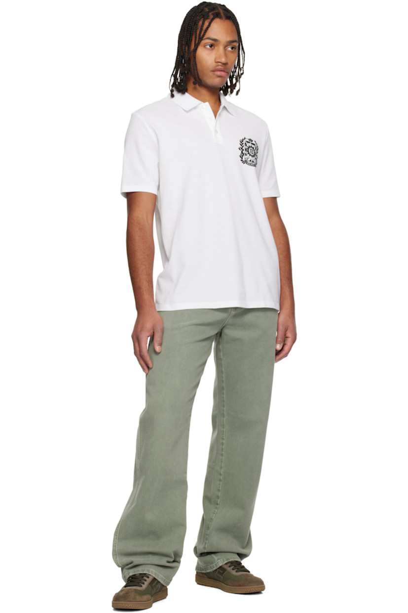 Low-top calfskin suede and cotton canvas sneakers.

· Serrated edges throughout
· Lace-up closure
· Logo embossed at padded tongue
· Padded collar
· Logo patch at sides
· Logo stamp at outer side and heel tab
· Buffed leather lining
· Treaded rubber sole

Supplier color: Khaki