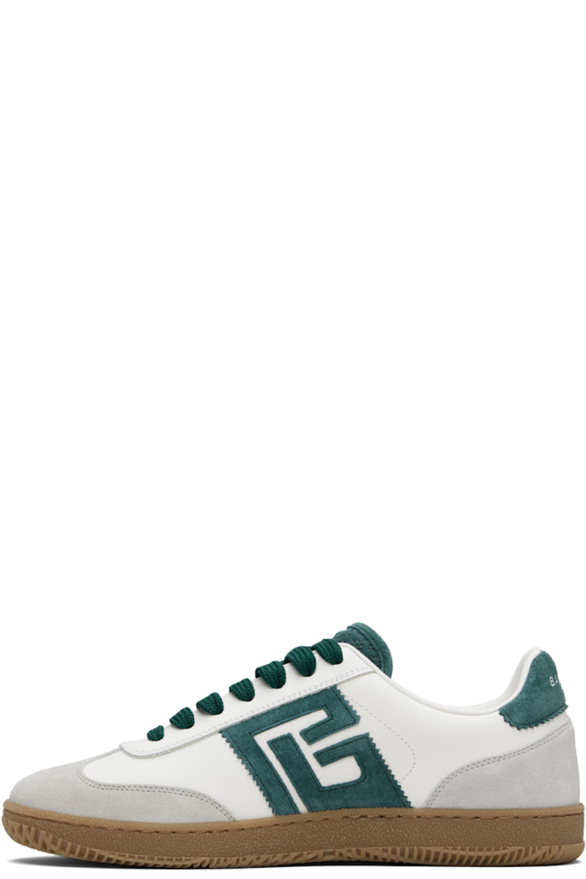 Low-top calfskin suede and buffed calfskin sneakers.

· Serrated edges throughout
· Lace-up closure
· Logo embossed at padded tongue
· Padded collar
· Logo patch at sides
· Logo stamp at outer side and heel tab
· Buffed leather lining
· Treaded rubber sole

Supplier color: White